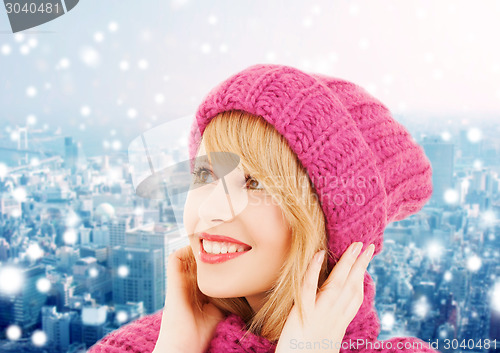 Image of smiling young woman in winter clothes