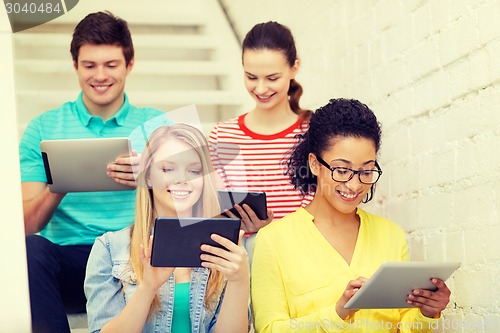 Image of smiling students with tablet pc computer