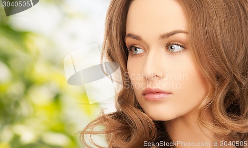 Image of beautiful young woman with bare shoulders