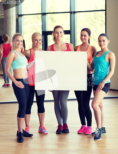Image of - group of women witn white blank billboard