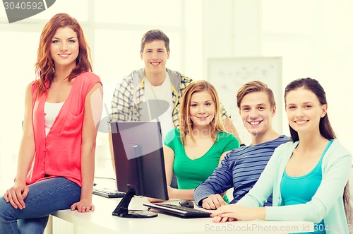 Image of group of smiling students having discussion