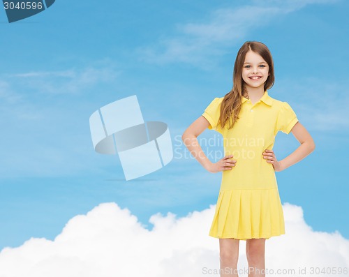 Image of smiling little girl in yellow dress