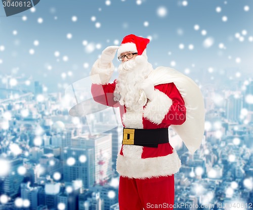 Image of man in costume of santa claus with bag