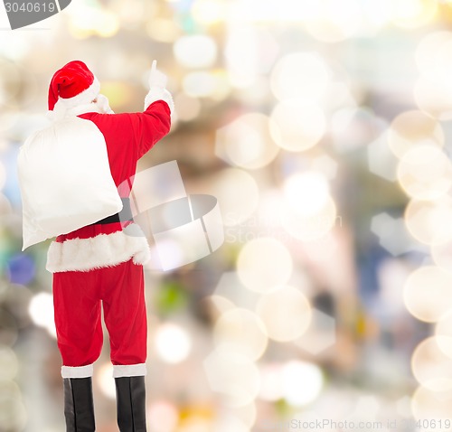 Image of man in costume of santa claus with bag