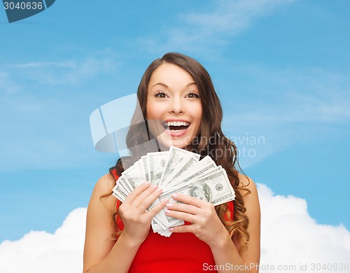 Image of woman in red dress with us dollar money