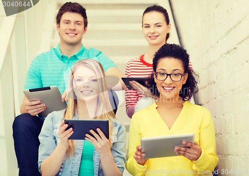 Image of smiling students with tablet pc computer