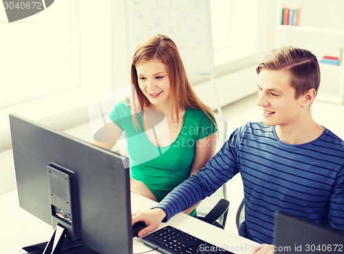 Image of two smiling students having discussion