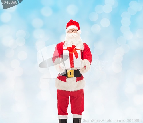 Image of man in costume of santa claus with gift box