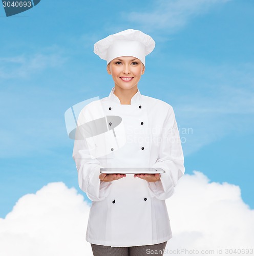 Image of smiling female chef with tablet pc computer