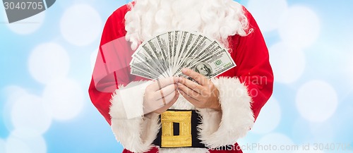 Image of close up of santa claus with dollar money