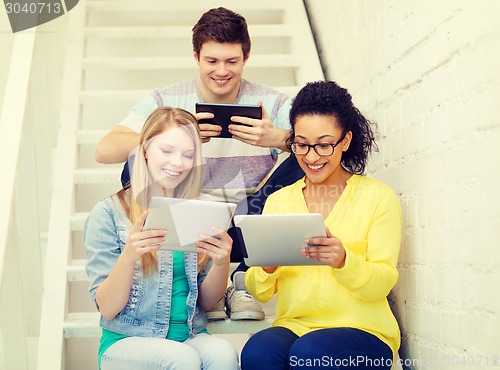 Image of smiling students with tablet pc computer