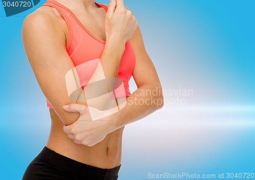 Image of sporty woman with pain in elbow