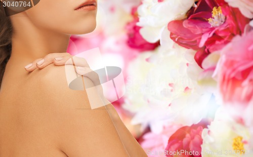 Image of beautiful young woman with bare shoulders