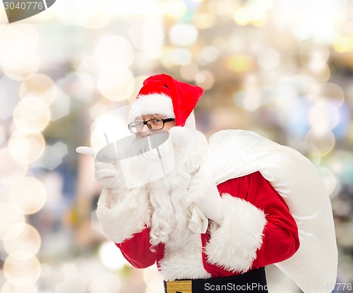 Image of man in costume of santa claus with bag