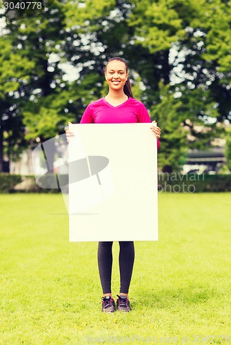 Image of smiling teenage girl with blank white board