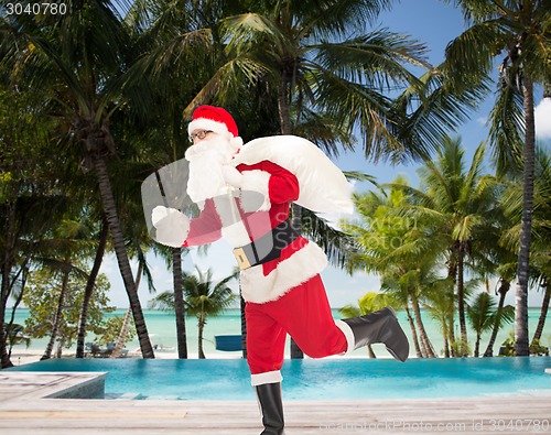 Image of man in costume of santa claus with bag