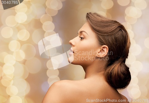 Image of beautiful young woman with bare shoulders