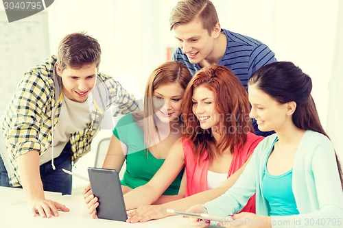 Image of smiling students with tablet pc at school