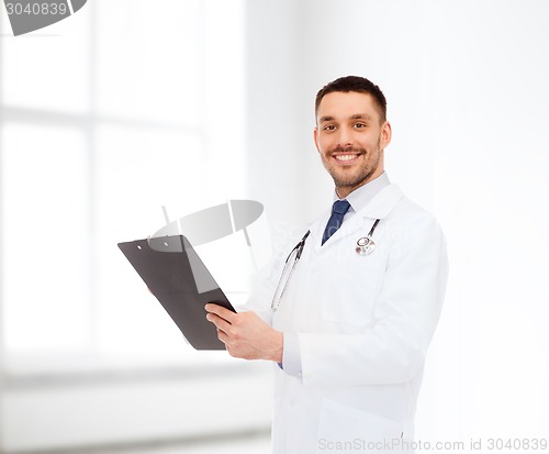 Image of smiling male doctor with clipboard and stethoscope