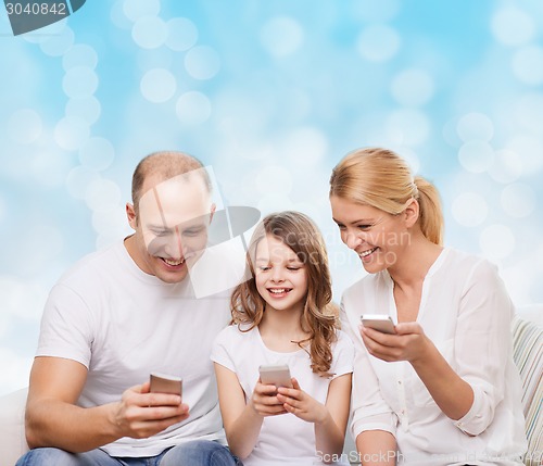 Image of happy family with smartphones