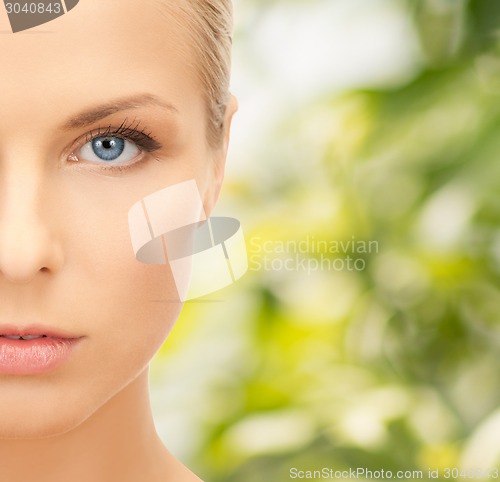 Image of beautiful young woman half face
