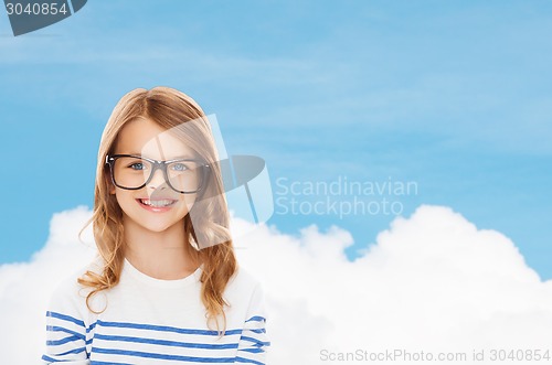 Image of smiling cute little girl with black eyeglasses