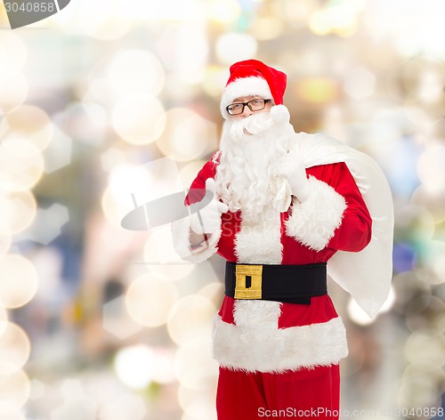 Image of man in costume of santa claus with bag
