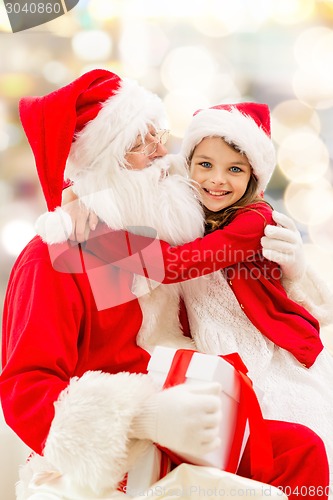 Image of smiling little girl with santa claus