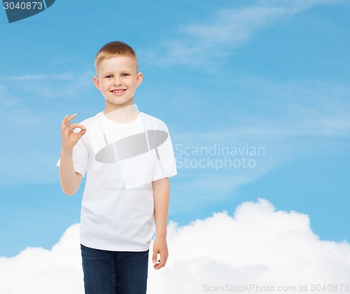 Image of smiling little boy in white blank t-shirt