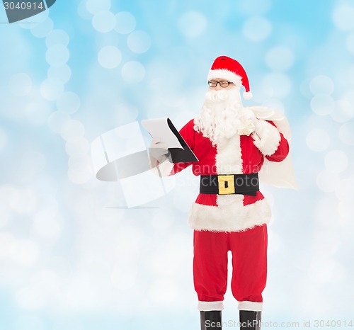 Image of man in costume of santa claus with notepad and bag