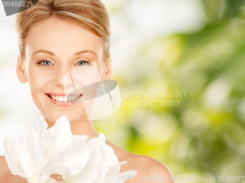 Image of beautiful young woman with bare shoulders