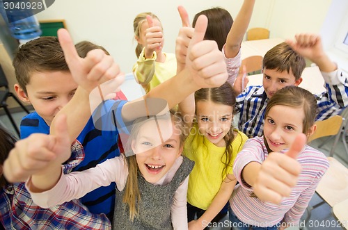 Image of group of school kids showing thumbs up