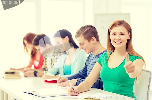 Image of students with textbooks and books at school