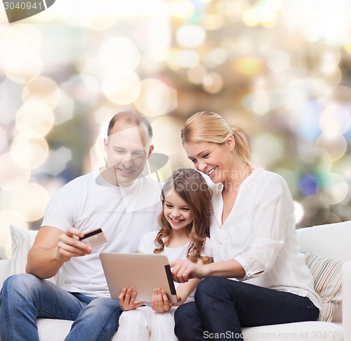 Image of happy family with tablet pc and credit card