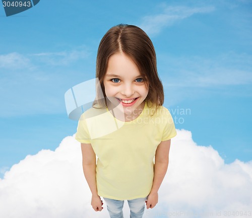 Image of smiling little girl over green grass background