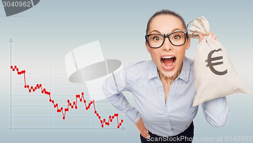 Image of shocked businesswoman holding money bag with euro