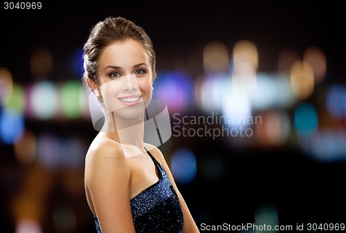 Image of smiling woman in evening dress