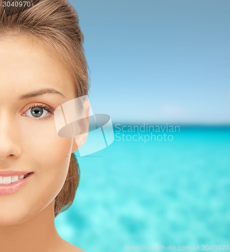 Image of beautiful young woman half face