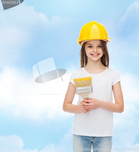 Image of smiling little girl in helmet with paint brush