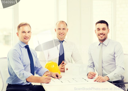 Image of happy team of architects and designers in office
