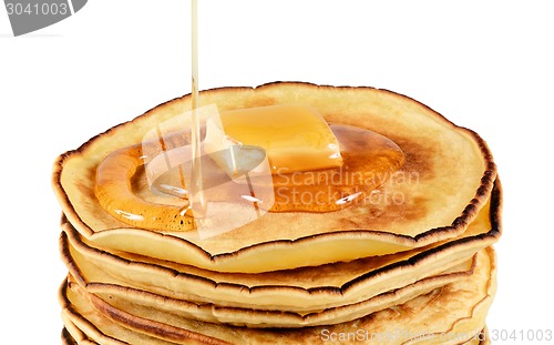 Image of Pancakes with butter and syrup.