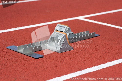 Image of Athletics starting blocks on race track