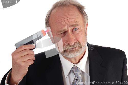 Image of Businessman dart gun