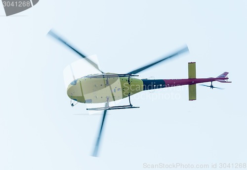 Image of Pilot of Eurocopter AS-350 on airshow. Bottom view