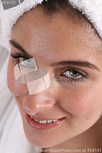 Image of Wet faced girl in towel