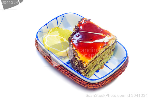 Image of Cake and slices of lemon on a white background.