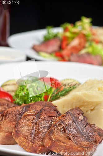 Image of tongue with grilled vegetable