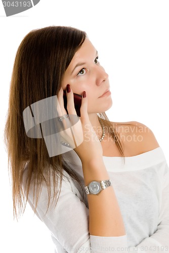 Image of Pretty woman talking by mobile phone