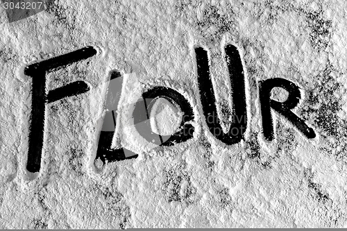 Image of White flour on black background