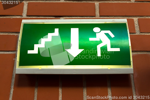 Image of Green emergency exit sign 
